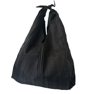 The Row Bindle Pleated Silk-organza Shoulder Bag in Black Suede inside Knot Top